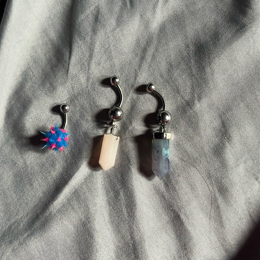 Three belly button rings